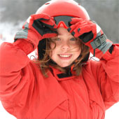 Child with a ski helmet.