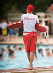 Lifeguard standing duty poolside.