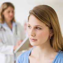 A woman visiting the doctor.