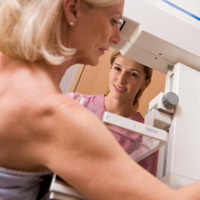 A woman gets a mammogram at her doctor&#039;s office.
