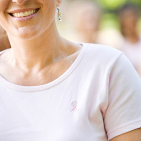 A woman participates in a walk to benefit cancer.
