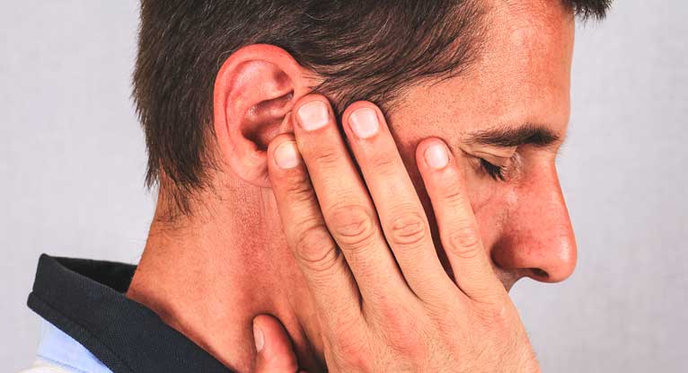 What does it mean when you have a hard lump behind the left ear?