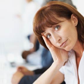 A women looks bored during a meeting