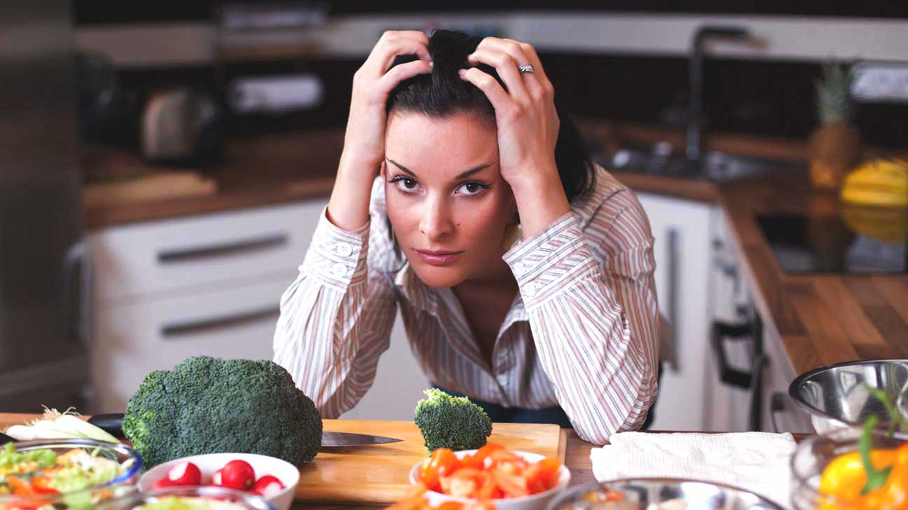 Woman Stressed in Kitchen